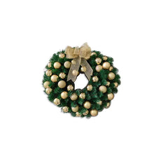 Decorative Christmas wreath with gold balls and a bow on a white background