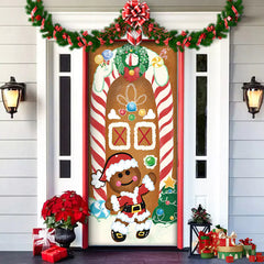 Decorative Christmas door with gingerbread man design, candy cane, and festive decorations.