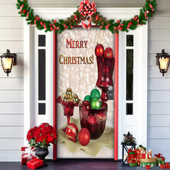 Decorative Christmas door with ornaments and 'Merry Christmas!' text on a white door.