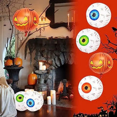 Halloween-themed room with pumpkins and decorative eyeballs, featuring a fireplace and candles.