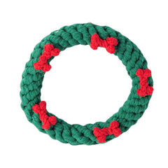 Green rope ring with red bone-shaped loops on a white background