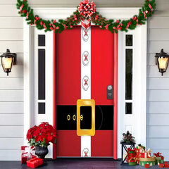 Decorative door with Santa Claus design and Christmas decorations on a house exterior.