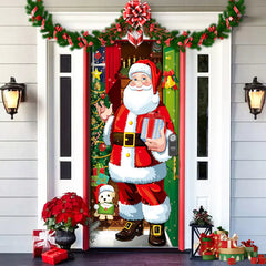 Decorative door with Santa Claus holding gifts, surrounded by Christmas decorations on a house exterior.