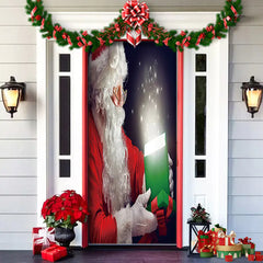 Decorative door with Santa Claus holding a gift, surrounded by Christmas decorations on a house exterior.
