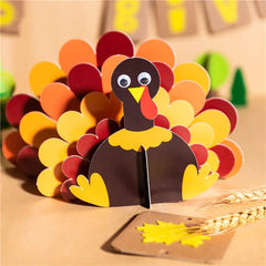 Colorful paper turkey craft on a wooden surface with a blurred background