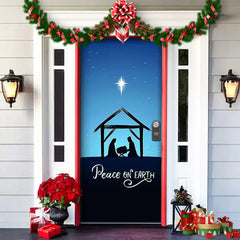 Decorative door with nativity scene and 'Peace on Earth' text, surrounded by Christmas decorations.