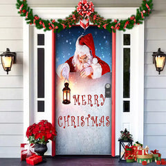 Decorative door with Santa Claus, 'Merry Christmas' text, and festive decorations on a house exterior.