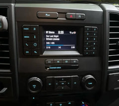 Car dashboard with radio and control buttons