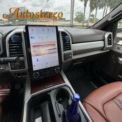 Car interior with a touchscreen display and 'Autostereo' branding.