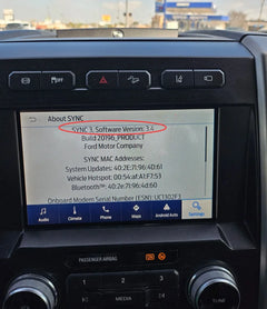 Car infotainment system displaying SYNC 3 software version on a screen