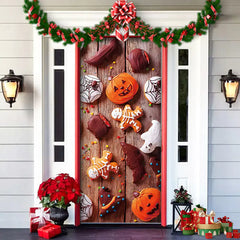 Decorative door with Halloween-themed cookies and decorations on a wooden surface.