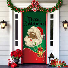 Decorative Christmas door with Santa Claus design and 'Merry Christmas' text, surrounded by festive decorations.