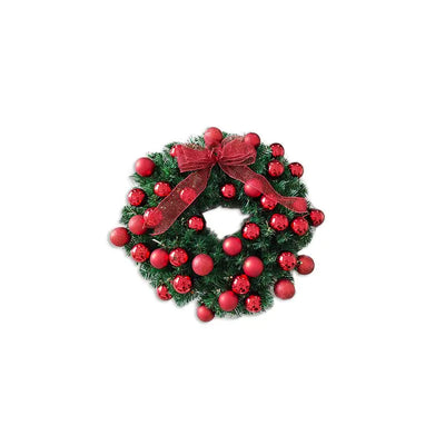 Christmas wreath with red berries and a bow on a white background