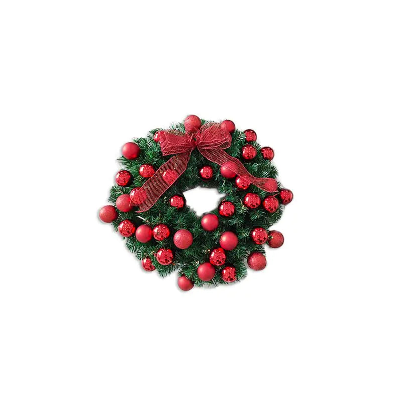 Christmas wreath with red berries and a bow on a white background
