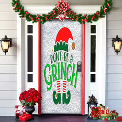 Decorative door with Christmas-themed door decal and festive decorations on a house exterior.
