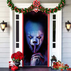 Decorative door with a clown face design, surrounded by Christmas decorations on a house exterior.
