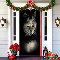 Decorative door with a cat illustration, Christmas garland, and poinsettias on a wooden door.