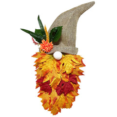 Decorative gnome with autumn leaves and a straw hat on a white background