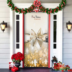 Decorative door with Christmas-themed decorations including a large gold bow, red bows, and festive lights.