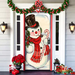 Decorative door with a snowman design, red scarf, and candy cane, surrounded by Christmas decorations.