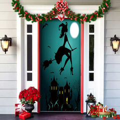 Decorative door with witch and castle design, surrounded by Christmas decorations.